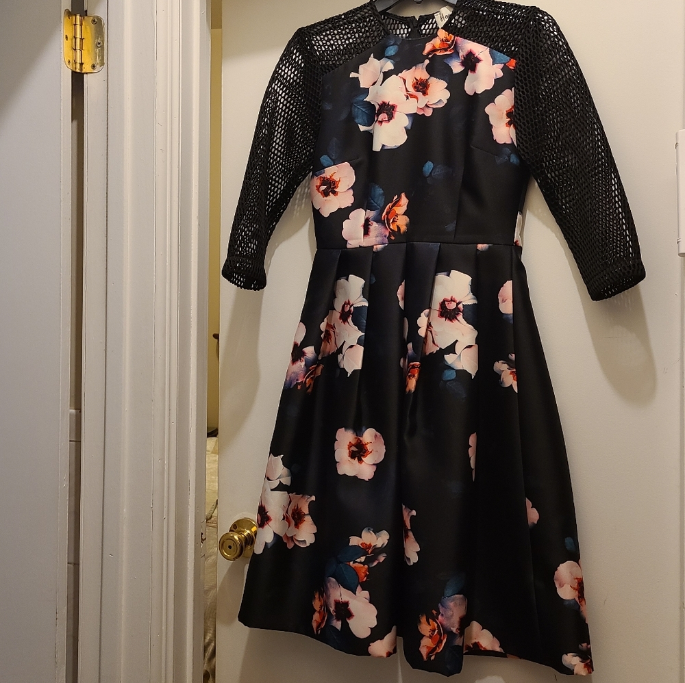 Black floral elegant party dress with mesh sleeves. Size 0. Knee length